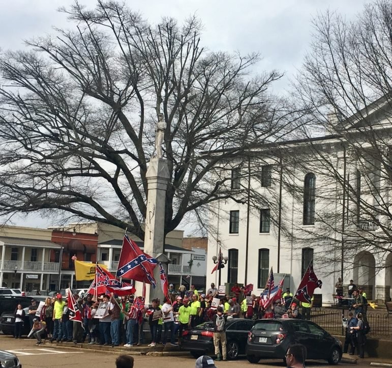 Pro-monument protestors wave Confederate flags in February, 2019