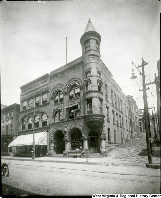 The Merchants and Mechanics Savings Bank in 1924. Note the presence of the witch's cap, which was removed due to safety concerns. Photograph from West Virginia and Regional History Center at WVU Libraries