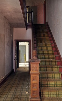 An interior staircase within the mansion.