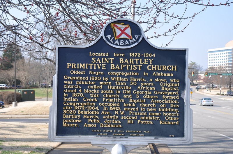 One side of the marker which states the overview of the St. Bartley Church located on Williams Avenue. 