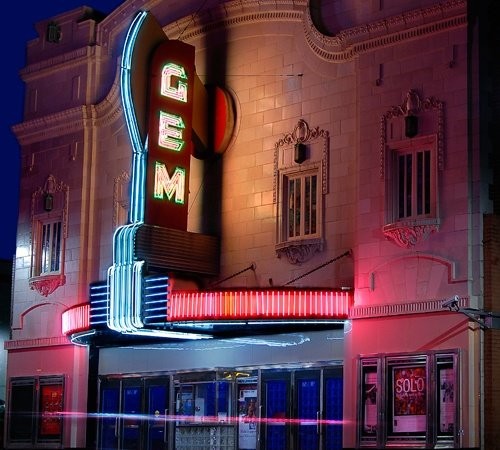 Photo of the beautiful GEM theater illuminated brightly by neon lights