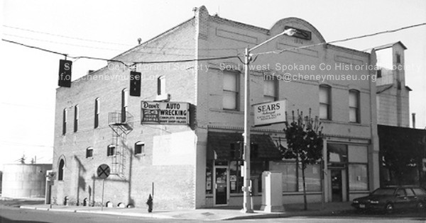 1970s view of the Odd Fellows building, Sears Outlet, Rogers Towing signs