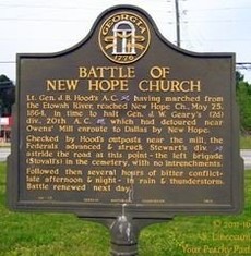 The Battle of New Hope Church Landmark is located in front of New Hope Church in Dallas, Georgia.