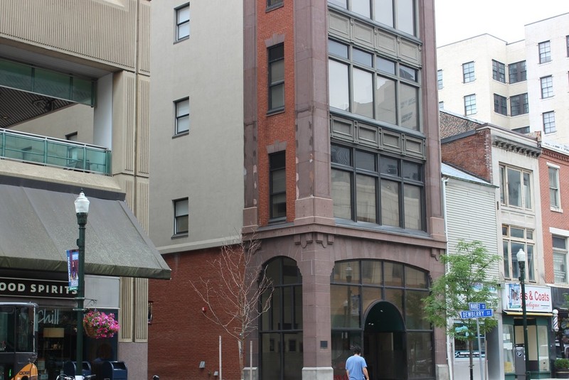 A good view of the brownstone façade and brick construction of the Seel Building.