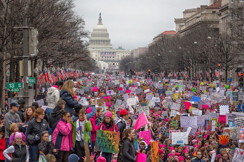 Demonstrators march along Pennsylvania Avenue, with the Capitol Building in the background. Wikimedia Commons.