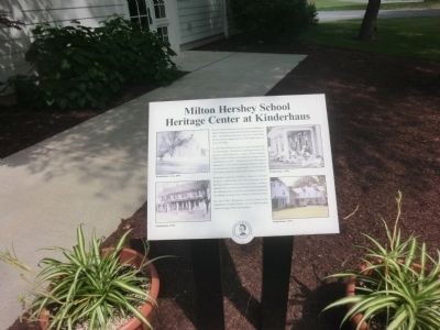 The marker placed at the building to signify the dedication of Milton Hershey.