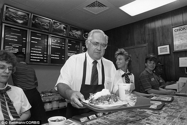 Dave Thomas serving his signature square hamburger (a reminder of his promise to never cut corners).