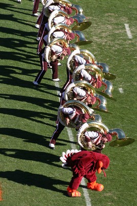 The Marching Virginians tuba section performing the Hokie Pokie in the north end zone; image by By RadioFan (talk) - Own work, CC BY-SA 3.0, https://en.wikipedia.org/w/index.php?curid=24415216