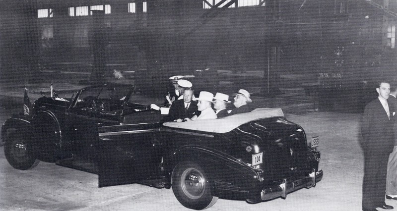 President Franklin D. Roosevelt tours the Ordnance Plant on Sept. 3, 1940. The car was made especially for the President. The "USSS" on the license plate stands for "United States Secret Service."