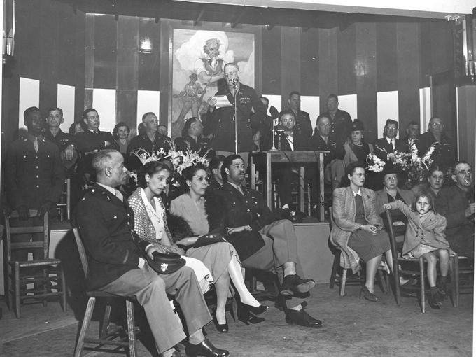 event in 1942 at the Mountain View Black Officers Club, a speech is being given.