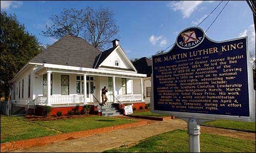 The exterior of the house and a plaque commemorating it.