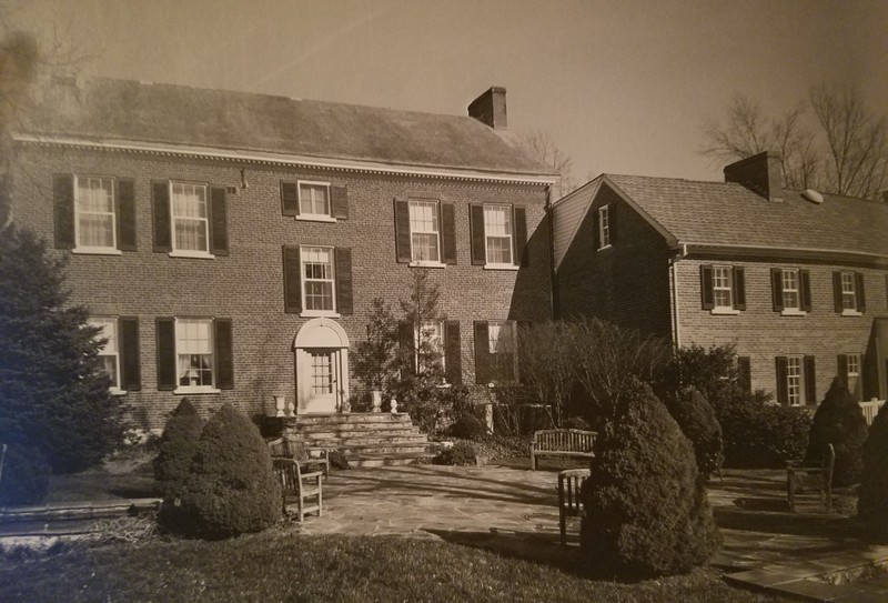 A rear view of the house showing the two-story kichen wing on the right.