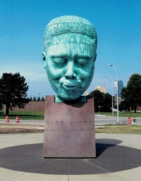  Measuring 10 feet in height, mounted on 8 feet high base. At E 18th St & Vine St Kansas City, MO 64108. Sculptor Robert Graham. Inscription:  Charlie “Bird” Parker Plaza  Mayor Emanuel Cleaver II  Board of Parks & Recreation Commissioners:  Ollie W. Gates, President; Sheila Kemper Dietrich, Commissioner; Anne Garney, Commissioner; Terry R. Dopson, Director  City Council:  Ed Ford, Teresa Loar, Jim Glover, Paul Danaher, Ronald E. Finley, Mary Williams-Neal, Evert Asjes III, Aggie Stackhaus, Ken Bacchus, Kelvin Simmons, George D. Blackwood, Judy Swope.  Robert Graham, Sculptor  In loving memory of Blanche Jones and Doris Jones-Stein.  Given by the Jules and Doris Stein Foundation, the Oppenheimer Brothers Foundation, and Tony and Marti Oppenheimer. Dedicated in March of 1999.