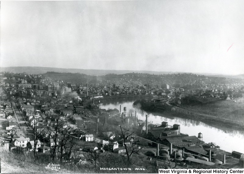 This view of Sunnyside shows the Morgantown Brick Company's location in the bottom righthand corner. The rounded kilns were easily distinguished amongst other industries on the river, such as glass factories. West Virginia and Regional History Center