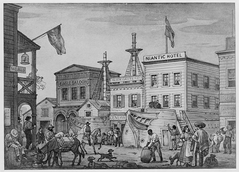 An illustration circa 1850 showing two of the Gold Rush ships that were hauled ashore and built upon while being converted to new use as public buildings. On the right, the ship Niantic is being converted into a hotel.