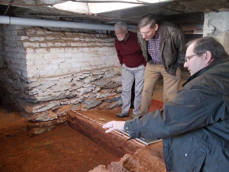 Liberty University archaeologists working inside the cellar at Mead's Tavern.