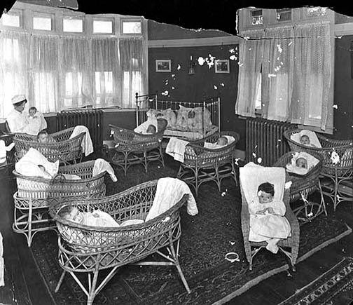 A group of newborn babies in the hospital around 1910