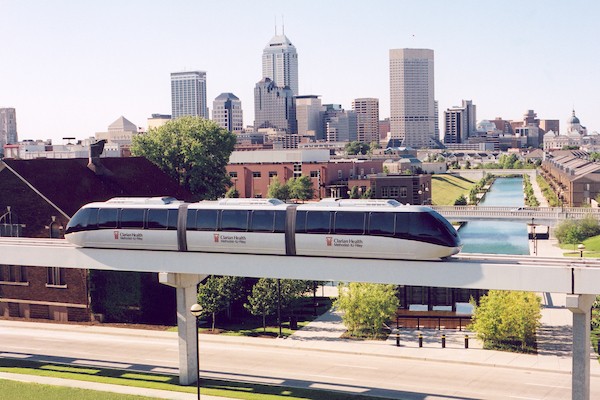 A picture of the people mover with downtown Indianapolis as the backdrop