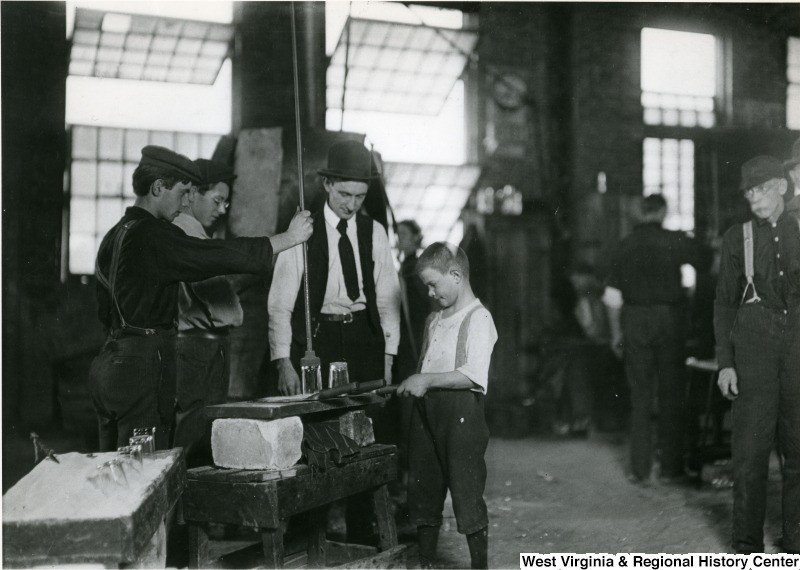 Lewis Hine photograph from 1908 of a child working in the Union Stopper Company factory. West Virginia and Regional History Center, WVU Libraries, and Library of Congress.