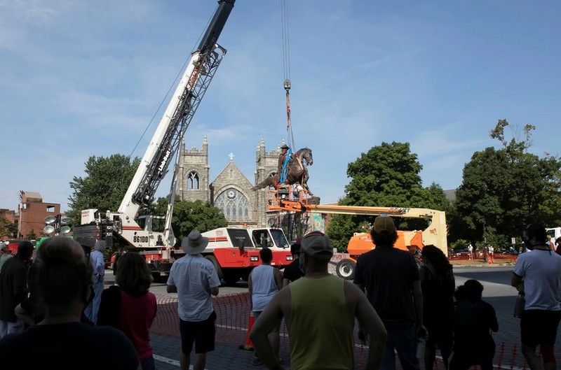 A crowd watches the removal of Richmond's statue to Jeb Stuart