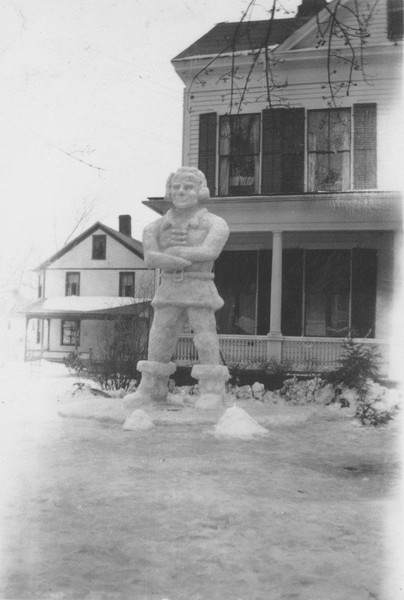 Winter Carnival snow sculpture of a Colonial man, ca. February 1941. A snow sculpture created for the traditional campus Winter Carnival depicts a Colonial man, possibly a Minuteman.