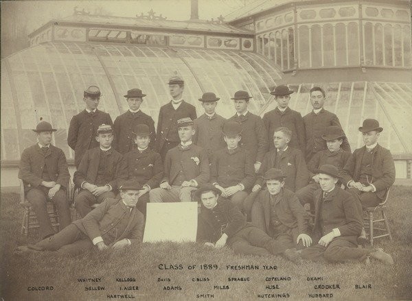 Class photo of 1889 taken in front of Durfee Plant House during freshman year, 1885. Lovell, J. L. (John Lyman), 1825-1903 (photographer)