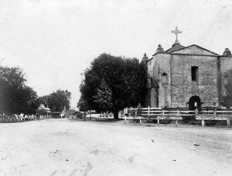 Arcangel circa 1870. The unpaved road at left is El Camino Real (the King's Road"), the 600-mile trail that connected all 21 missions, and California's first major overland commerce route.