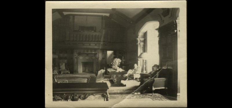 The Eppersons and a friend inside the main living room of the home