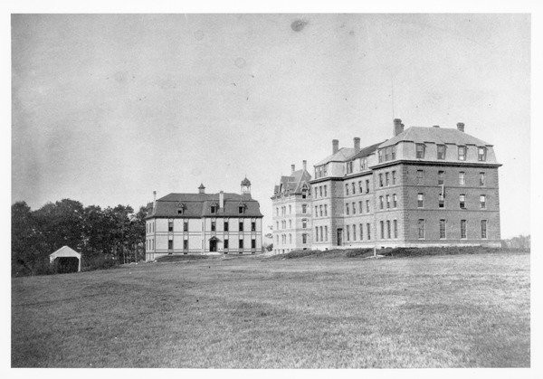 Original buildings at Massachusetts Agricultural College; South College, North College, and College Hall (r. to l.), ca. 1875. Phi Sigma Kappa was founded in North College, which was located near today's Machmer Hall.