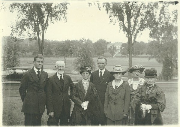 Barnes, Lincoln Wade (photographer). Kenyon L. Butterfield and family, 1922.
Kenyon Butterfield is shown posing for a portrait with his family, which consists of a son, three older women and an older man, and his wife. 