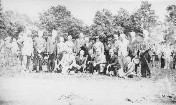 Cornerstone ceremony for Goodell Library and Thatcher Hall, November 3, 1934. President Hugh Potter Baker, Massachusetts Governor Joseph B. Ely and former President Kenyon L. Butterfield gather with members of the Board of Trustees, among others, dur