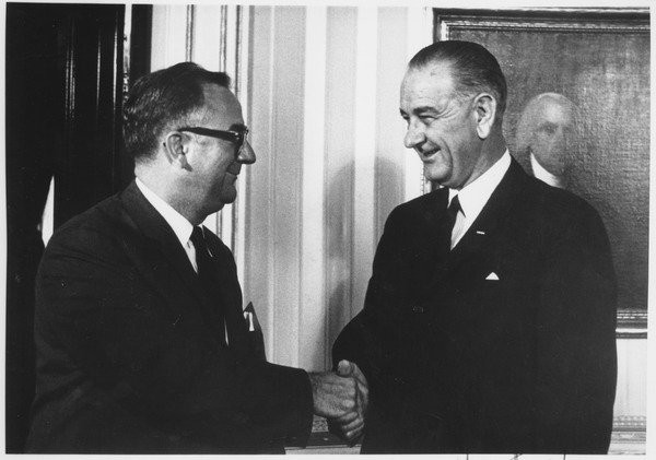 Oswald Tippo shakes hands with Lyndon B. Johnson, October 8, 1964.