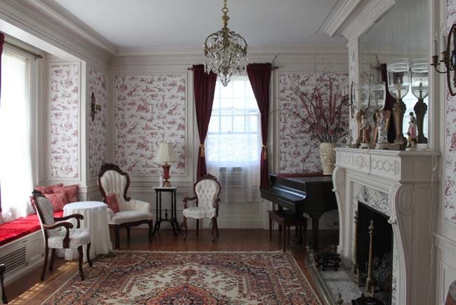 Another room within the mansion with period accents and furnishings.  