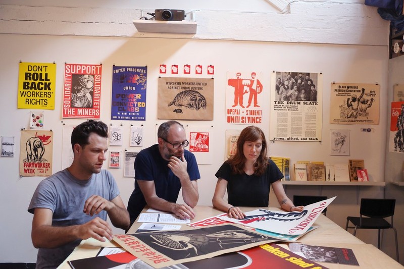 Kevin Caplicki, Josh MacPhee and Molly Fair at the Interference Archive. Credit: Michael Appleton for The New York Times