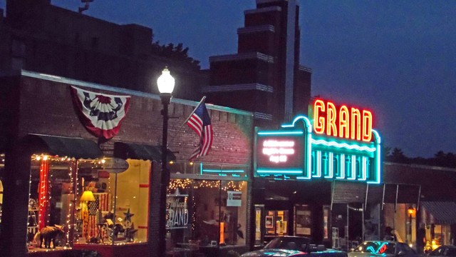 The Grand Auditorium today, with its restored historic neon marquee, a highlight of the forward-looking Art Deco and Streamline Moderne architectural movements, especially evident in American motion picture palaces. (CinemaTreasures user).