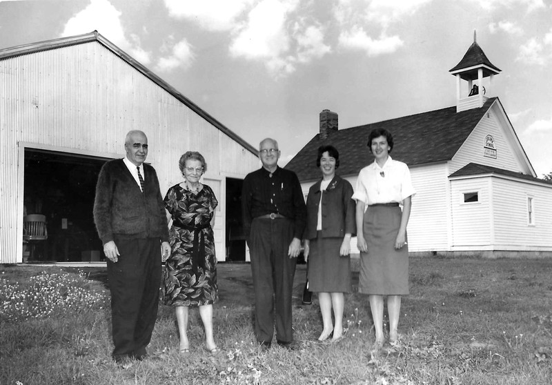 The Barron County Historical Society's 1968 Board Members stand in front of the original Pioneer Village Museum - the Joliet School and first pole building. Pictured from left to right are Clarence Seidle, Myrtise Seidle, Andy Helland, Kay Antenne, and Betty Christianson. This photo would have been taken prior to August 1968; Board President, Clarence Seidle, passed away in August that year and Vice President Andy Helland filled out the rest of his term through December.