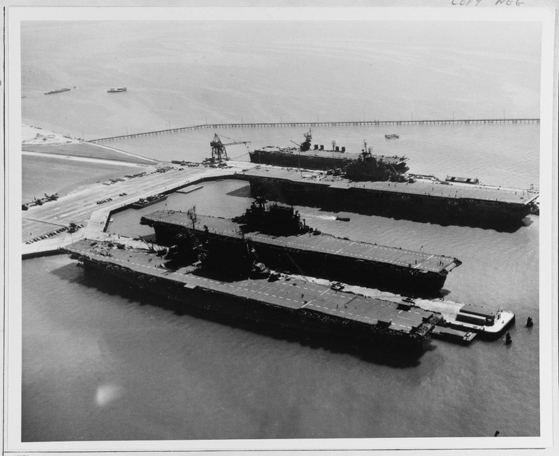 Four aircraft carriers docked for service at NAS Alameda during World War II: USS Saratoga (CV-3); USS Enterprise (CV-6); USS Hornet (CV-12) and USS San Jacinto (CVL-30) (NHHC).