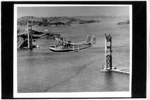 The first westward flight of the China Clipper, Pan-Ams trans-Pacific mail and passenger service, flies past the incomplete Golden Gate Bridge in 1935. The China Clipper was moved to Treasure Island during World War II.