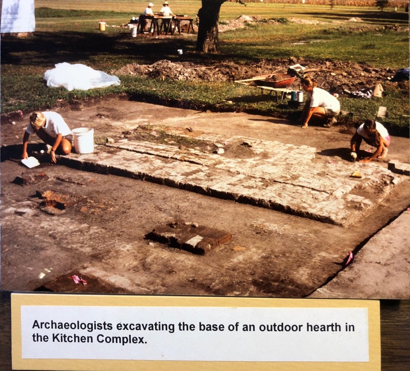 Archaeologists excavating the base of an outdoor hearth in the Enslaved Kitchen Complex in 1994.