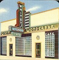 Yellow and glass brick building with large Whitey's Wonderbar sign projecting out from the building.