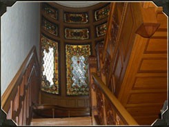 As you travel up the staircase that Ana Millikin had renovated, stop and look through the original stained glass windows.