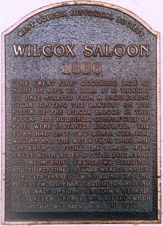 The plaque, located at 100 N Woodland Ave