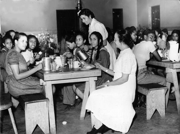 Murray Atkins Walls helping serve lunch to girl scouts at Camp Dan Beard (Todd). 
[Image courtesy of the University of Louisville]