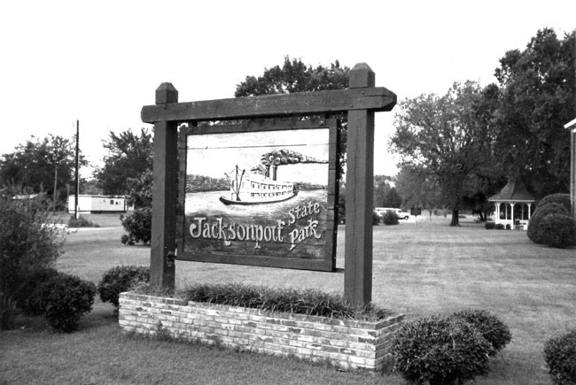 A black and white photo of a sign.