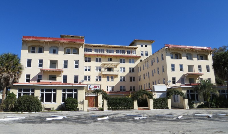 The current appearance of the Putnam Hotel. Most of its windows and doors are boarded up and padlocked, but many of Deland's homeless population have at points taken up residence in the hotel's remains.