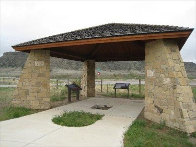 The original monument was dedicated in the late 1950s and now includes a stone pavilion with interpretive signage. 