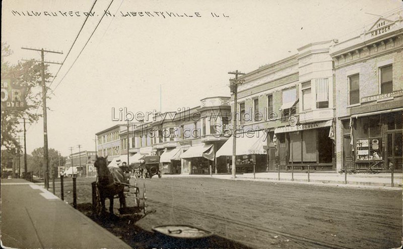 Looking north on Milwaukee Avenue,  Enderlin awning on right, circa 1913