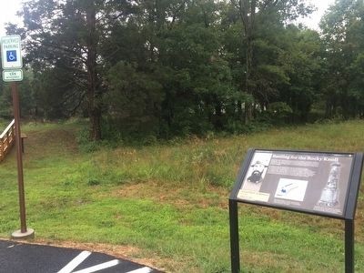 By J. Makali Bruton, September 4, 2015
The unfinsihed railroad grade can be seen roughly in the background og this image, right before the treeline.