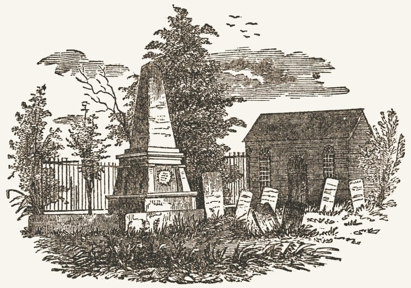 Old St. Peter's Church and monument at the grave of John Paulding.