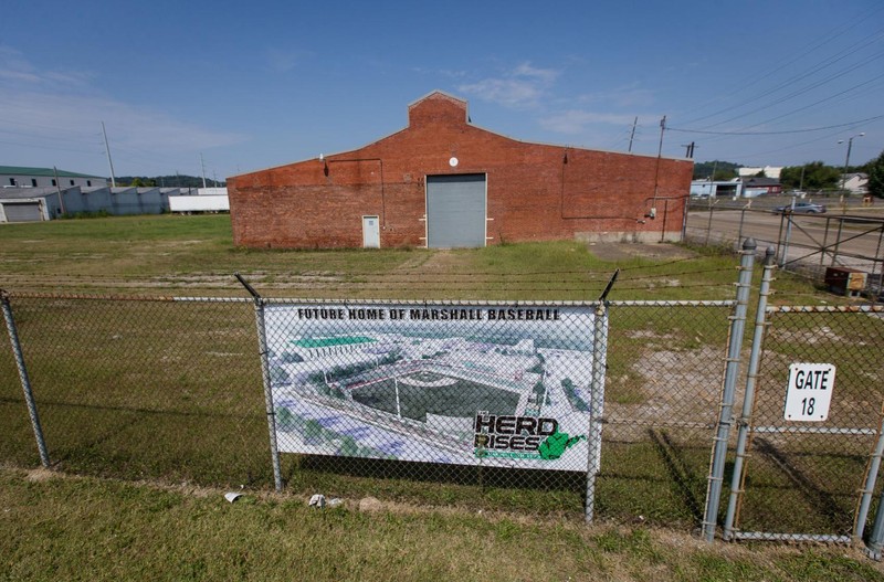 A sign at the former plant advertises the site of the future Marshall baseball stadium